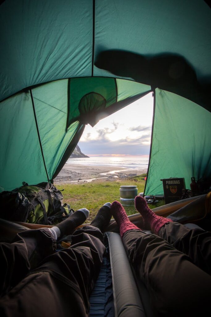 Two People Lying Inside Tent