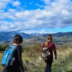 Two Women Walks to Open Field