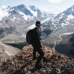 man standing on rock mountain