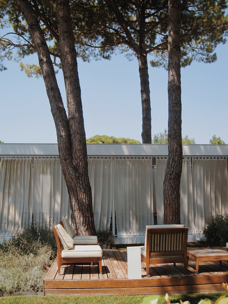 a deck with chairs and trees