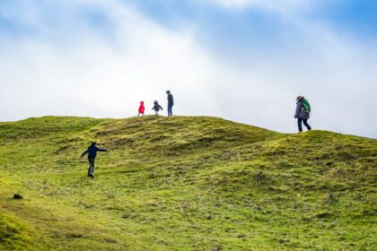 several people on mountain top