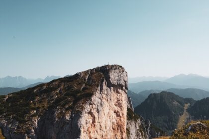 a person standing on top of a mountain